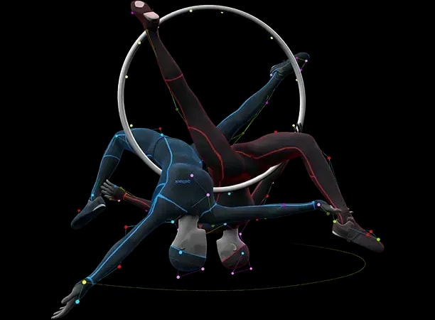 Two avatars wearing motion capture suits on a ring in a gymnastic pose.